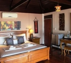 Двухместный коттедж двуспальная кровать в Amber Sands Beach Resort