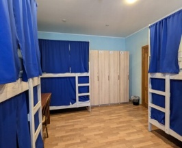 Кровать в восьмиместном номере в Maestro Hostel