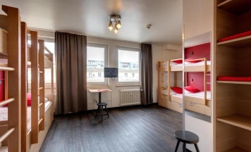 Кровать в общем номере в MEININGER Hotel München City Center