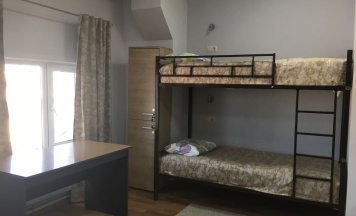 Кровать в общем 12-местном номере для мужчин и женщин в Энергия