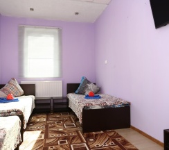 Кровать в 3-местном общем номере в Уютный дом