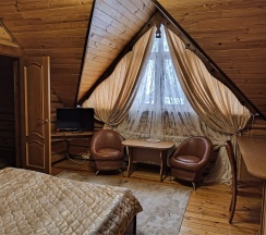 Двуместный номер в деревянном коттедже с cауной в Колыба