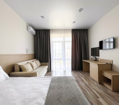 Корпус Андорра Стандарт с Раскладным Двуспальным Диваном в Family Pride Inn Прайд
