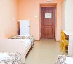 Кровать в 3-местном общем номере в Smart Hotel KDO Пенза