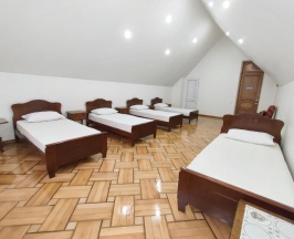 Кровать в общем номере с балконом и с красивым видом из окна в Batumi Sun Hostel