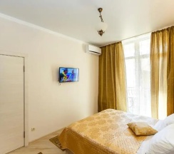 Апартаменты c 1 комнатой с балконом и рядом с пляжем в Апартаменты Apartment on Primorskaya