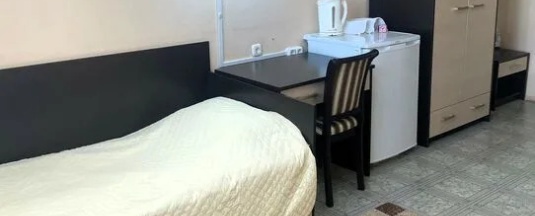 Кровать в общем номере в Фотон