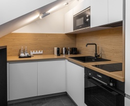 Двухместные апартаменты Deluxe Мансарда двуспальная кровать в The Basilian Minsk, Curio Collection by Hilton