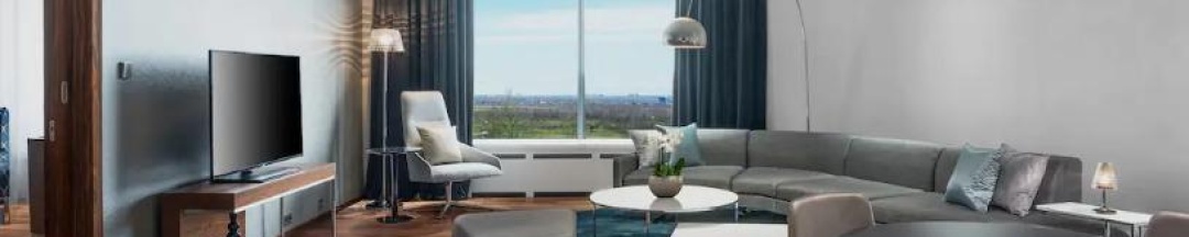Номер угловой люкс с 1 двуспальной кроватью в Hilton Saint Petersburg ExpoForum