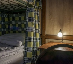 Кровать в общем номере в Good Inn