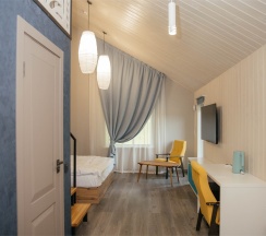 Двухуровневый Джуниор Сюит на втором этаже со своей зоной отдыха в Игуана