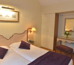 Двухместный люкс двуспальная кровать в Hôtel Suites Unic Renoir Saint Germain