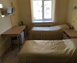 Кровать в 2-местном номере эконом в Гостиница Кристалл