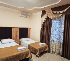 Трехместный номер с отдельным выходом во двор в Guest house city center