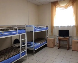 Кровать в общем номере в Мангазея