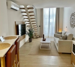 Четырёхместные апартаменты Deluxe с видом на город в Hotel emblemático Hi Suites