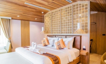 Двухместная вилла Seaside Wing Deluxe рядом с пляжем двуспальная кровать в Kacha Resort and Spa Koh Chang