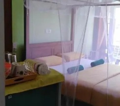 Двухместный номер с видом на сад двуспальная кровать в Jaga Bay Resort