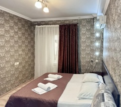 Двухместный номер Standard Мансарда с балконом и с красивым видом из окна двуспальная кровать в Тропики