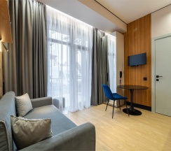 Апартамент с диваном в Булгаков by Sateen group