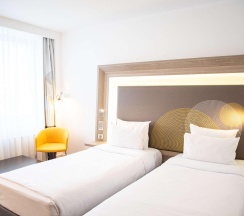 Номер стандарт улучшенный с 2 односпальными кроватями в Novotel Krasnoyarsk center