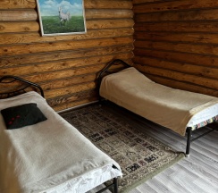 Кровать в общем номере в Kolsay_kazakh_village