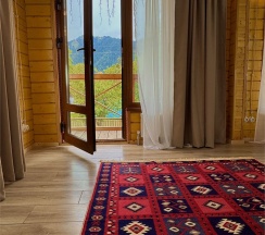 Двухкомнатный комфорт с общей террасой и видом на горы | 2 этаж в Hayat Haus