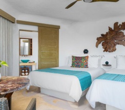 Номер с видом на океан в Shangri-la Caribe Beach Village Resort