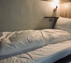 Кровать в общем номере в DAN Hostel