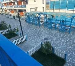 Двухуровневый ПОЛУЛЮКС с зоной отдыха на крыше и видом на бассейн в Santorini Family Club