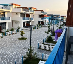 Двухуровневый ПОЛУЛЮКС с зоной отдыха на крыше и видом на море в Santorini Family Club