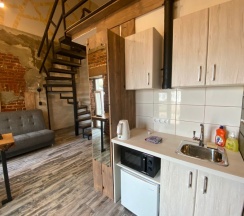 Улучшенные двухуровневые апартаменты с мини-кухней в Loft Apart