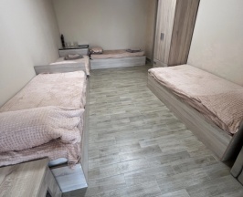 Кровать в общем номере в Ника