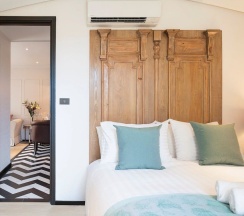 Семейный люкс с балконом в The Symphony Suites Pattaya