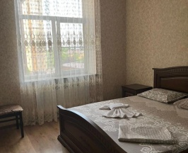 Четырёхместные апартаменты с 2 комнатами с видом на город в Квартира на Улице Победы