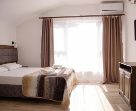 Четырёхместные апартаменты с 2 комнатами с балконом и с видом на горы в Талион