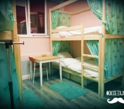 Кровать в общем номере (общая ванная комната) в В библиотеке