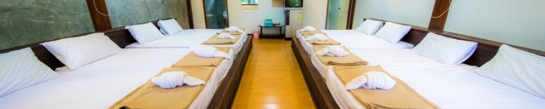 Кровать в общем номере в Tanita Lagoon Resort