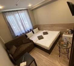 Номер "Стандарт + " с 1 двуспальной кроватью и 1,5 спальным дополнительным местом в Аэропорт Внуково