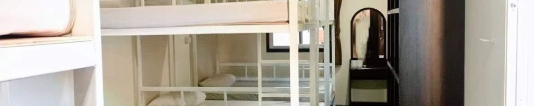 Кровать в общем номере в Sunwaree Phi Phi Resort