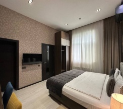 Номер Luxury в Home Hotel