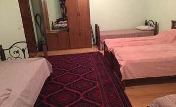 Кровать в общем номере в Уют