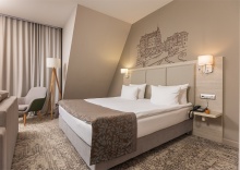 Представительский номер c 1 большой кроватью и раскладывающимся диваном в Holiday Inn Kaliningrad