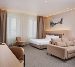 Номер делюкс стандарт в AurA City Hotel