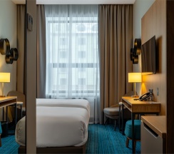 Стандартный номер с видом на город c двумя односпальными кроватями в Cosmos Omsk Hotel