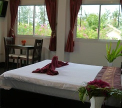 Двухместное бунгало Standard с видом на море двуспальная кровать в Ao Thai Resort