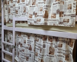 Кровать в общем номере в Хона