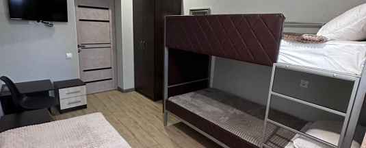 Кровать в 3-местном общем номере в Уют