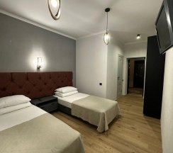 Номер стандарт с 2 односпальными кроватями в Альпина