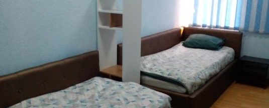 Кровать в 2-местном общем номере в Сова
